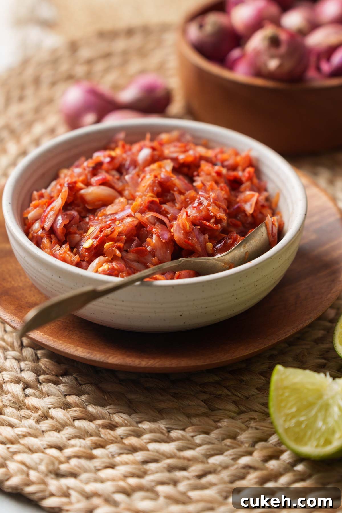 lunu miris or the spicy chili and onion sambal on a wooden bowl.