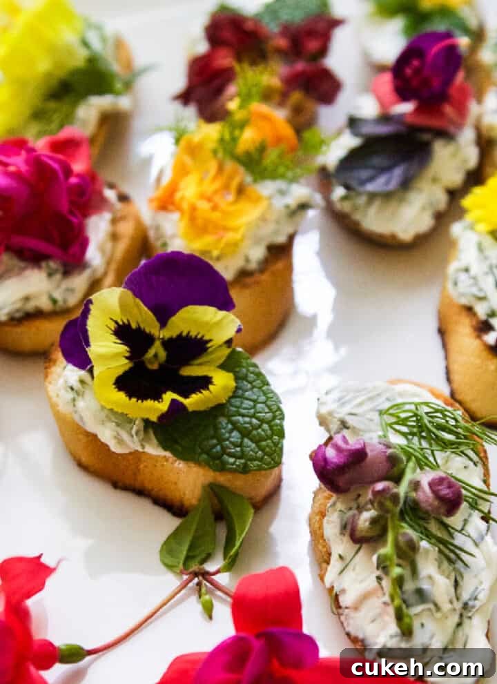 A white platter with crostini recipe topped with edible flowers and herbs.
