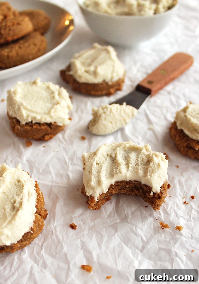 Soft pumpkin cookies with cashew frosting - Pillow-y soft pumpkin cookies topped with cashew frosting that tastes like buttercream. The perfect dessert recipe for fall or the holidays, especially Thanksgiving! (Gluten free and Dairy Free) | robustrecipes.com