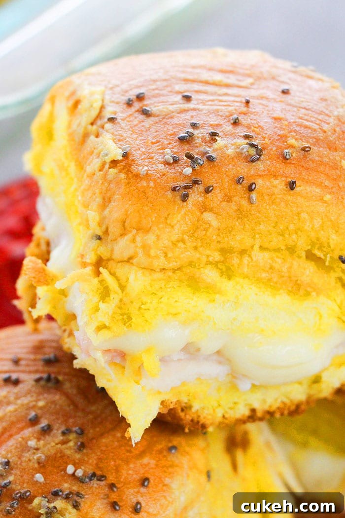 One-Pan Ham and Cheese Sliders Recipe for Quick Weeknight Meals 2 Closeup Shot of Hawaiian Ham and Swiss Sliders
