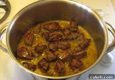 Turn the beef when the first side has browned for beef with artichokes moschari-me-agkinares