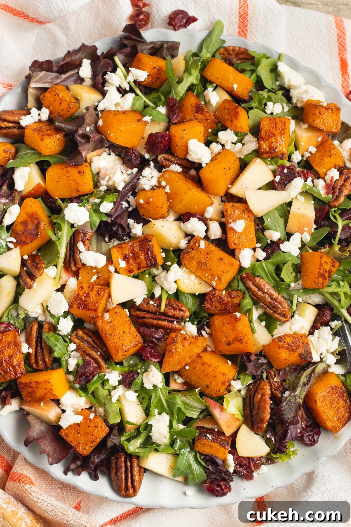This is a picture of a plate of butternut squash feta salad.