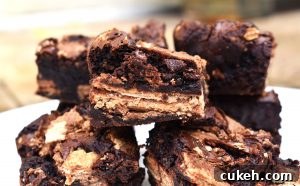 KitKat Brownies are rich and fudgy brownies filled with copious amounts of KitKats. We have two full KitKat blocks running throughout these brownies! #kitkats #kitkatbrownies #fudgybrownies
