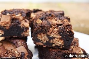 KitKat Brownies are rich and fudgy brownies filled with copious amounts of KitKats. We have two full KitKat blocks running throughout these brownies! #kitkats #kitkatbrownies #fudgybrownies