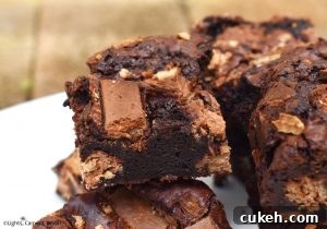 KitKat Brownies are rich and fudgy brownies filled with copious amounts of KitKats. We have two full KitKat blocks running throughout these brownies! #kitkats #kitkatbrownies #fudgybrownies