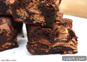 KitKat Brownies are rich and fudgy brownies filled with copious amounts of KitKats. We have two full KitKat blocks running throughout these brownies! #kitkats #kitkatbrownies #fudgybrownies