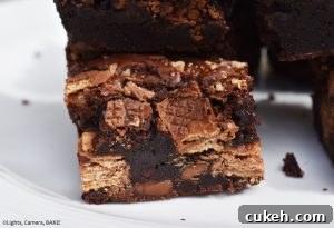 KitKat Brownies are rich and fudgy brownies filled with copious amounts of KitKats. We have two full KitKat blocks running throughout these brownies! #kitkats #kitkatbrownies #fudgybrownies