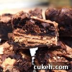 KitKat Brownies are rich and fudgy brownies filled with copious amounts of KitKats. We have two full KitKat blocks running throughout these brownies! #kitkats #kitkatbrownies #fudgybrownies