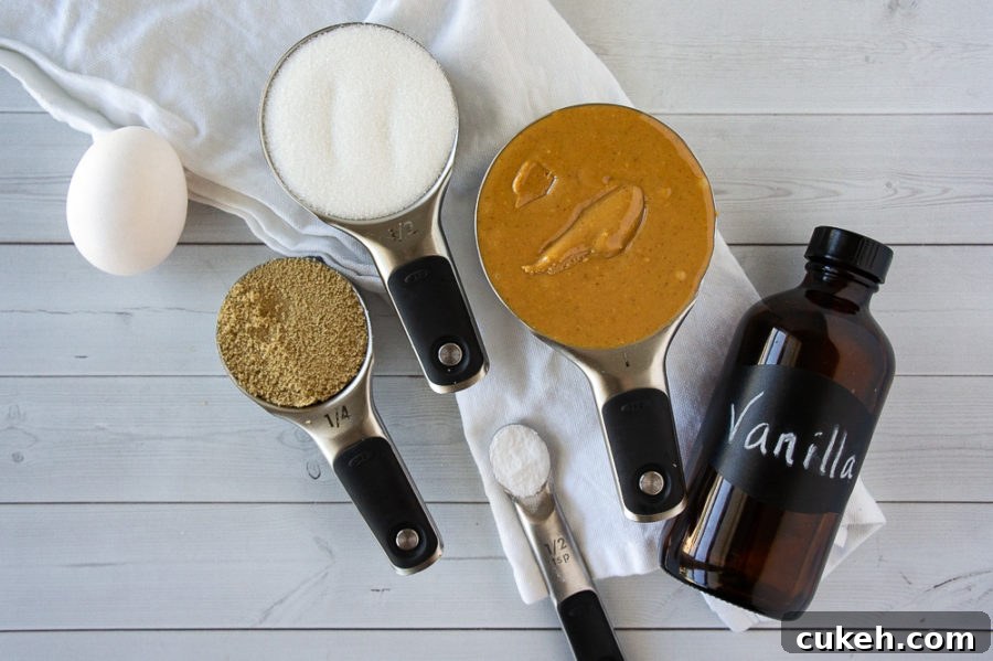 a cup of peanut butter, a quarter cup of brown sugar, a half cup of white sugar, a bottle of vanilla, one egg, and salt