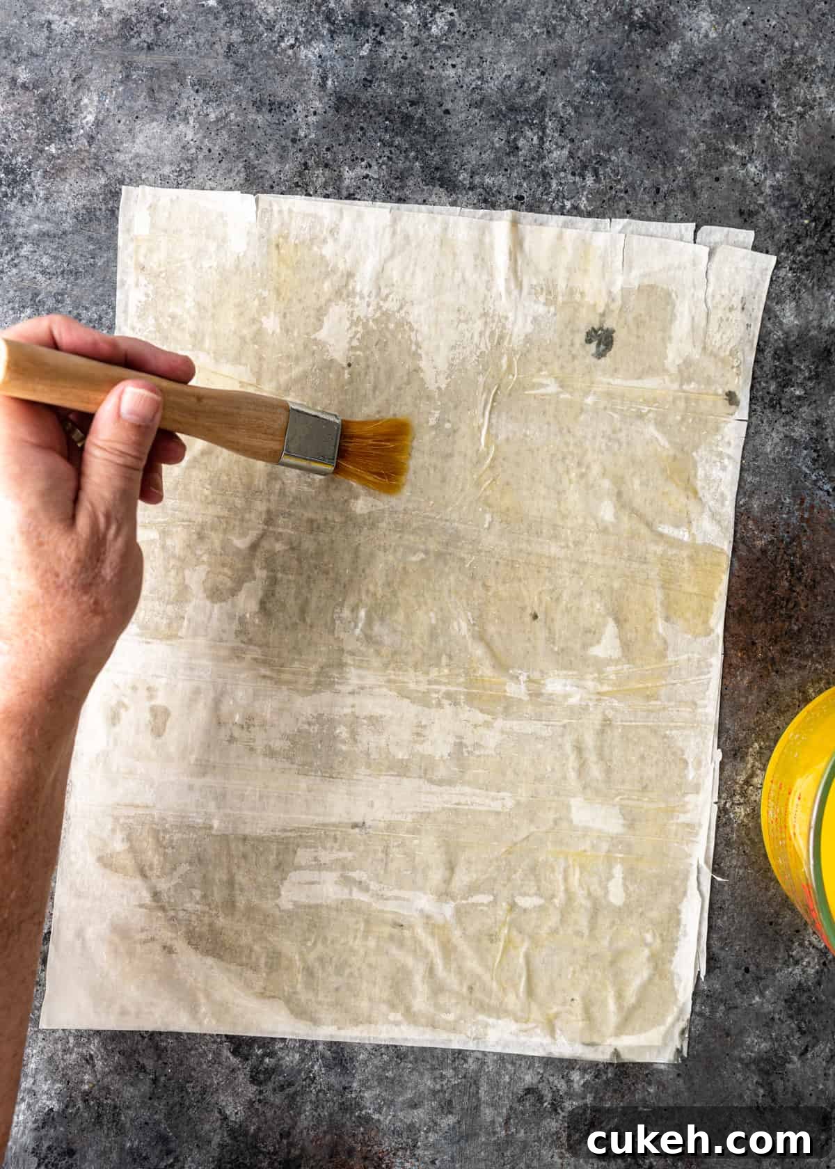 brushing butter on filo sheet