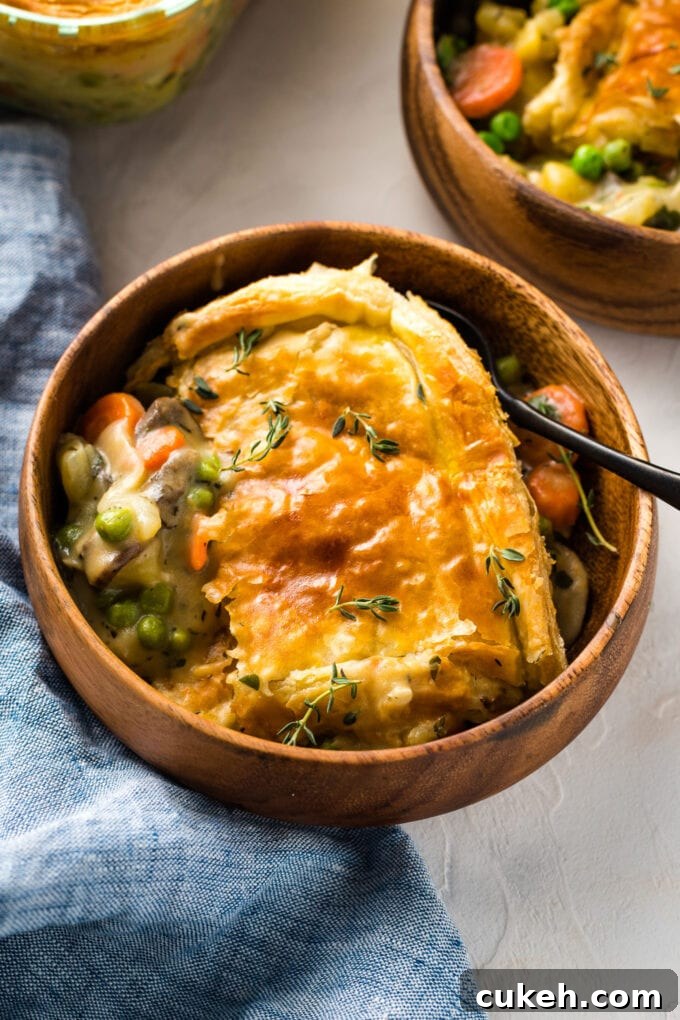 Fennel & Potato Vegetable Pot Pie Recipe — Savory Comfort Dish 3 Bowls of vegetarian pot pie with a creamy roux, ready to eat.