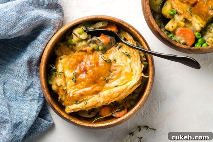 Fennel & Potato Vegetable Pot Pie Recipe — Savory Comfort Dish 10 Landscape image of wooden bowls with servings of pot pie.
